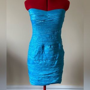 Party Season: Teal strapless dress.